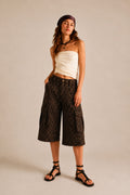 Leopard-print wide-leg cargo culotte shorts with flap pockets and an elastic back waistband.